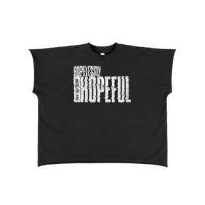 Black oversized T-shirt with a white distorted block typography graphic on the chest area, centered design.