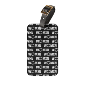 Black leather belt with a gold buckle draped over a black box with an MXN repeating pattern.