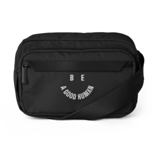 Black backpack with a curved white slogan reading 'BE A GOOD HUMAN' on the front pocket.